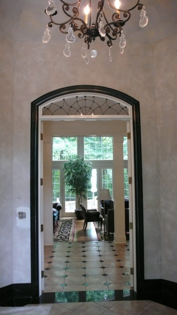 A view of the doorway from inside a house.