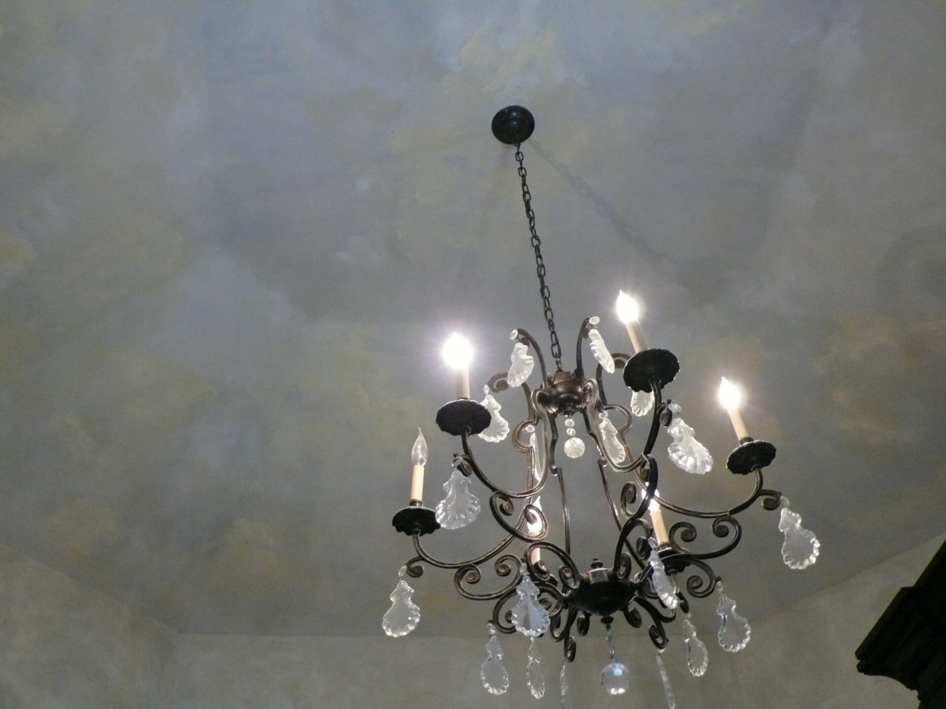 A chandelier with lights hanging from the ceiling.