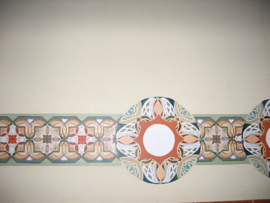 A wall with a decorative design on it.