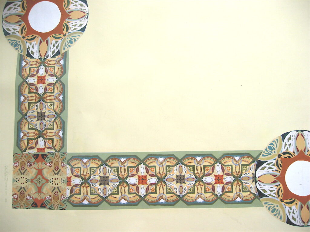 A close up of the corner of a room with a pattern