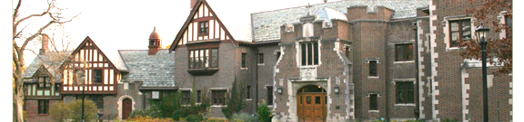 A large brick building with a wooden door.