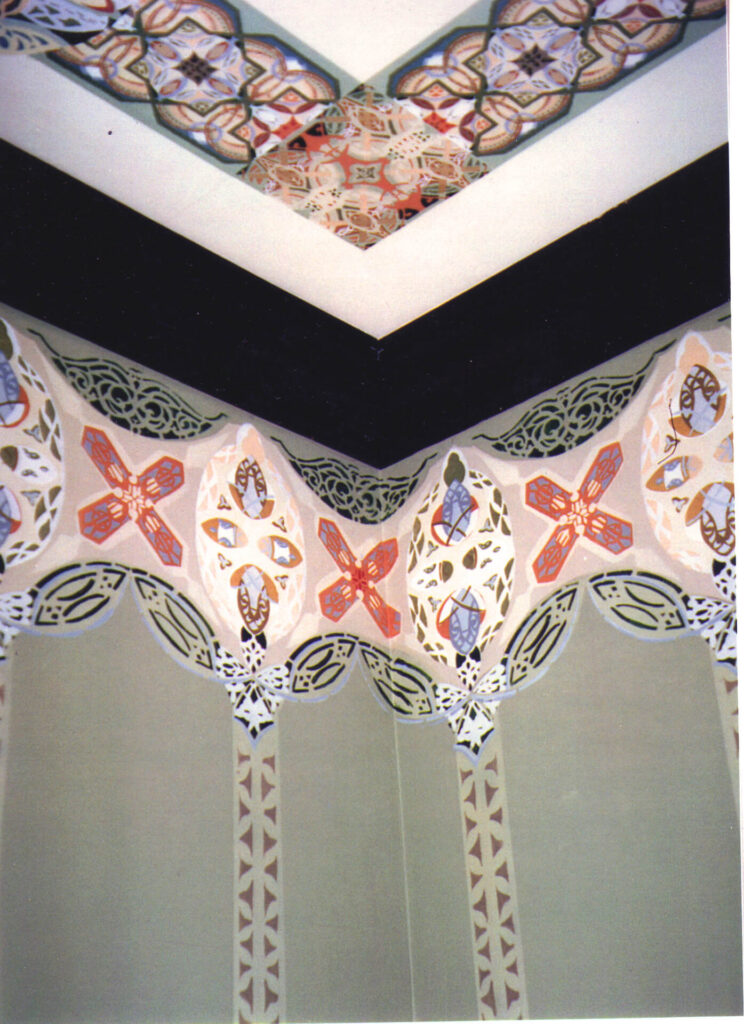 A ceiling with some decorative designs on it