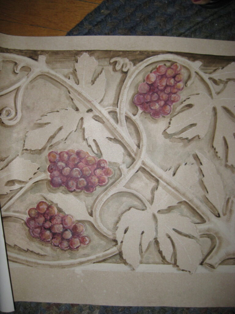 A close up of the grapes on the wall