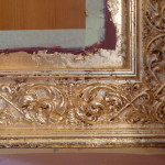 A gold frame with some paint on it